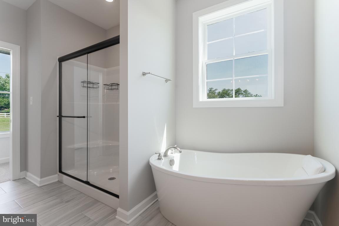 3671 Taneytown Road Gettysburg, PA 17325 - Photo 14 of 57 a white bath tub sitting next to a shower