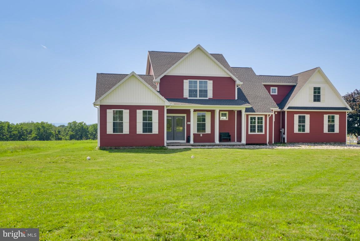 3671 Taneytown Road Gettysburg, PA 17325 - Photo 52 of 57 a front view of a house with a garden