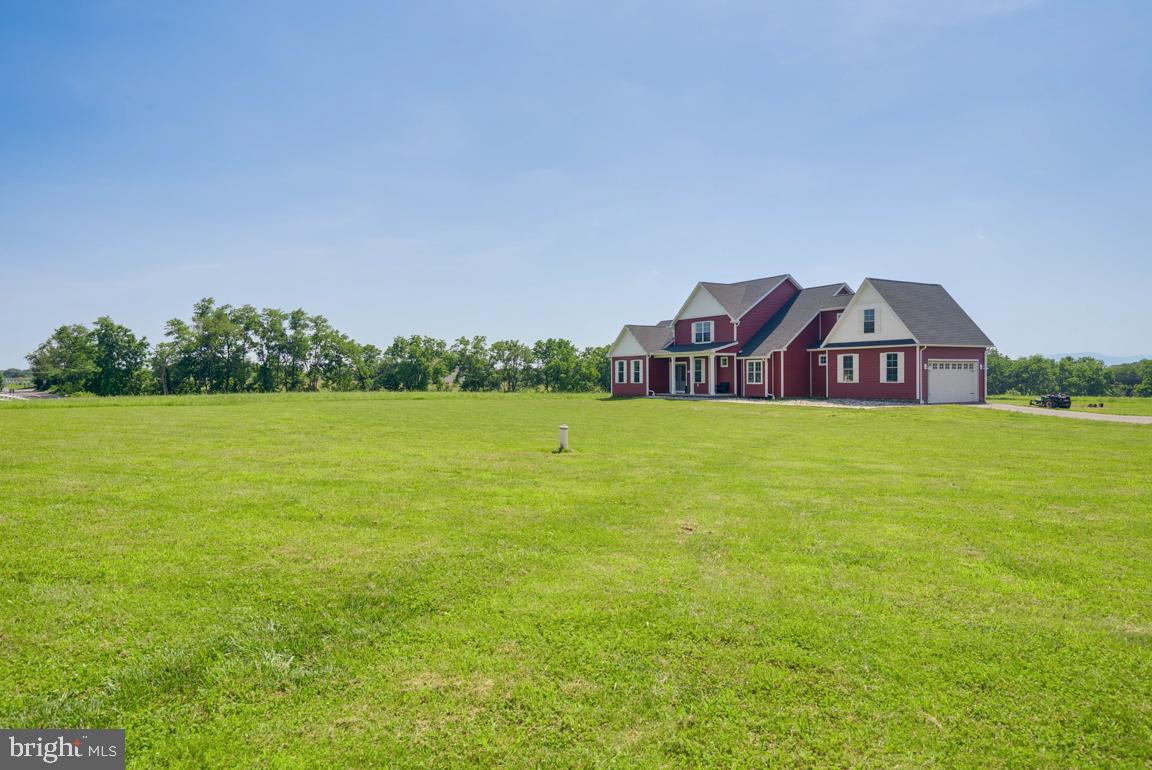 3671 Taneytown Road Gettysburg, PA 17325 - Photo 7 of 57 a view of a large garden with lawn chairs and large trees