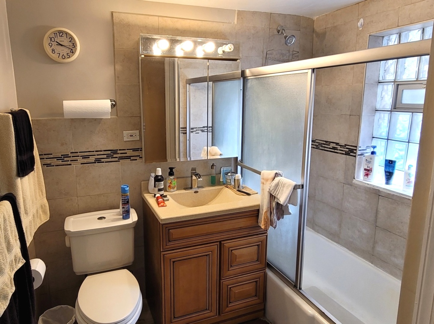 7432 West Gregory Street Chicago, IL 60656 - Photo 31 of 55 a bathroom with a sink toilet and shower