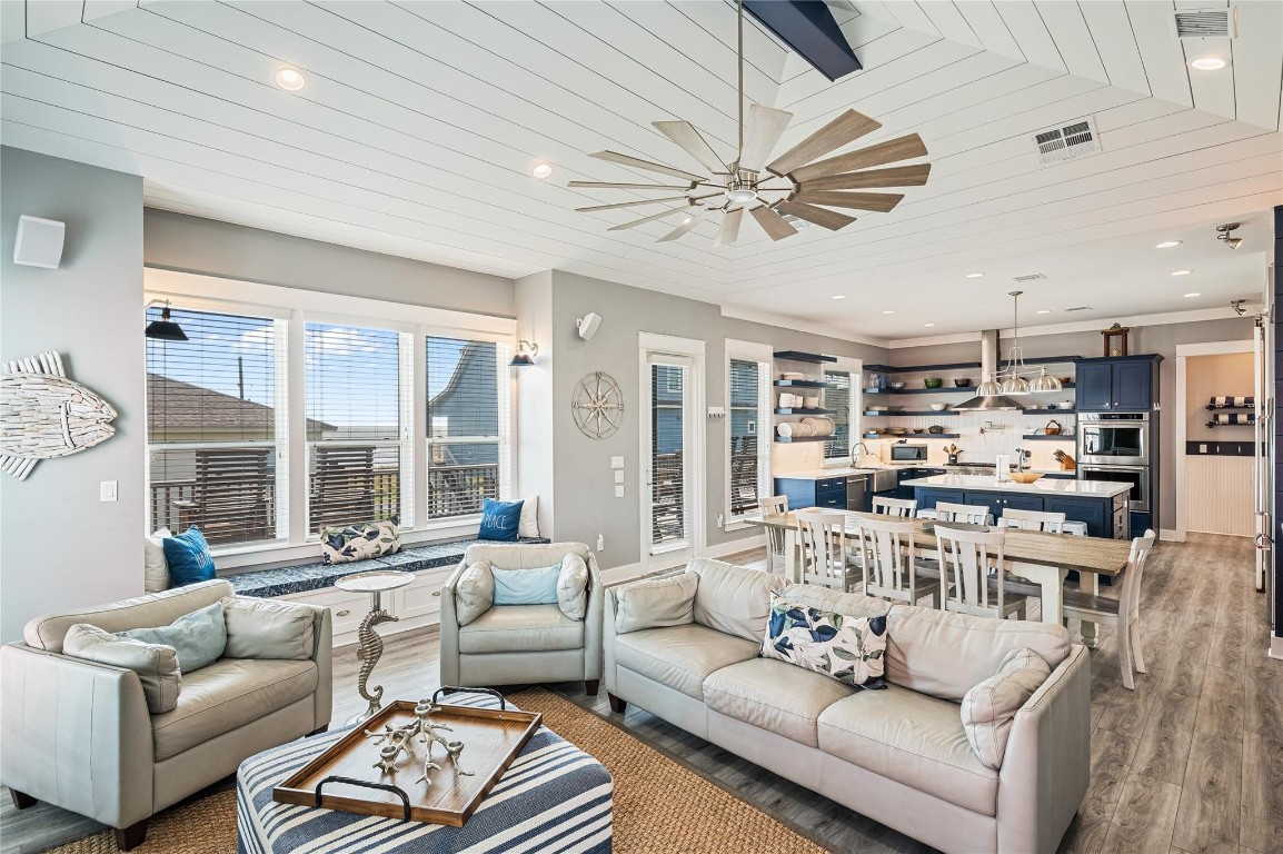 2576 Whitecap Crystal Beach, TX 77650 - Photo 16 of 49 a living room with furniture and a large window