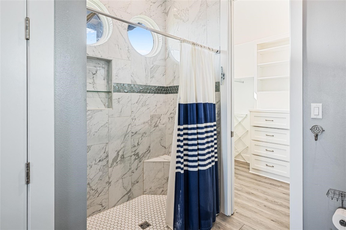 2576 Whitecap Crystal Beach, TX 77650 - Photo 27 of 49 a bathroom with a bathtub and shower