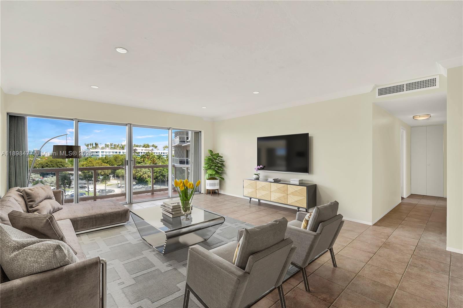 2451 Brickell Avenue, Unit 6N Miami, FL 33129 - Photo 13 of 43 a living room with furniture and a flat screen tv