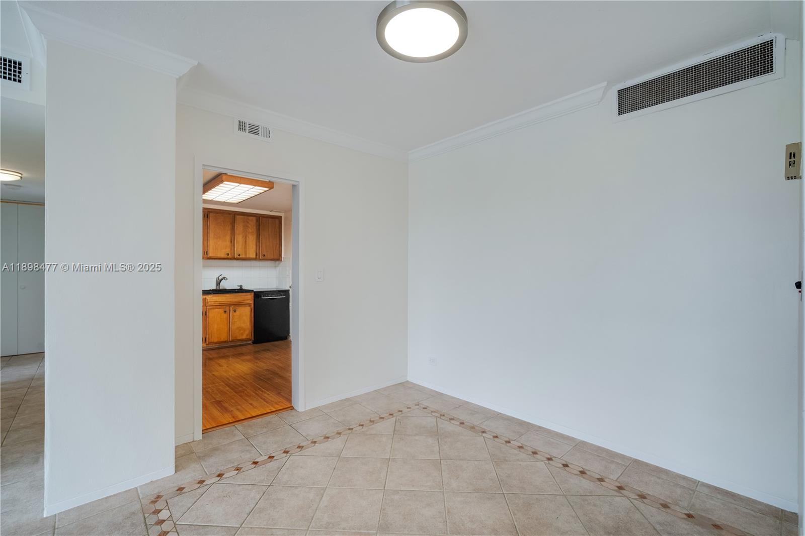 2451 Brickell Avenue, Unit 6N Miami, FL 33129 - Photo 17 of 43 an empty room with a bathroom and mirror
