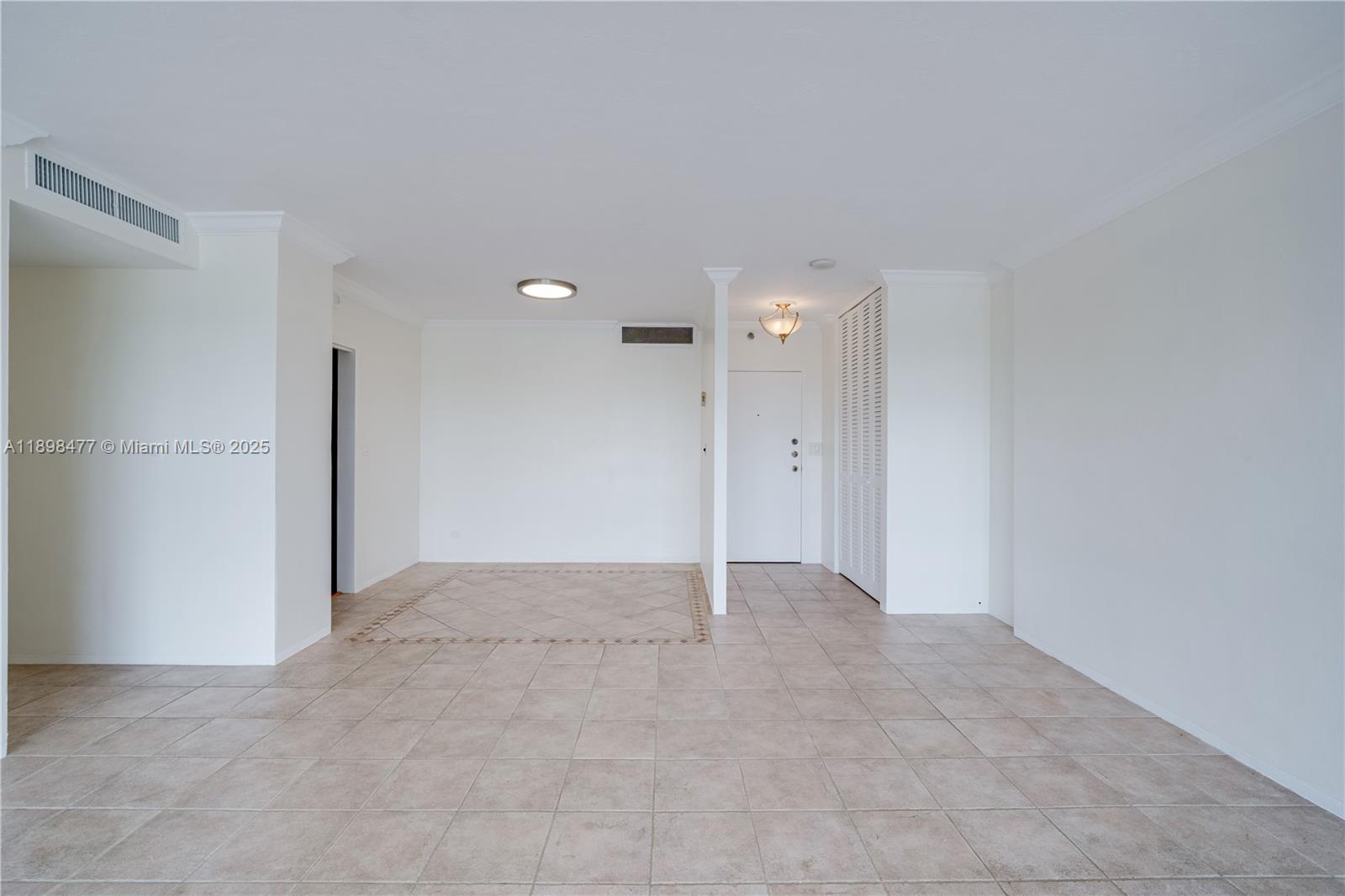 2451 Brickell Avenue, Unit 6N Miami, FL 33129 - Photo 19 of 43 an empty room with an entryway