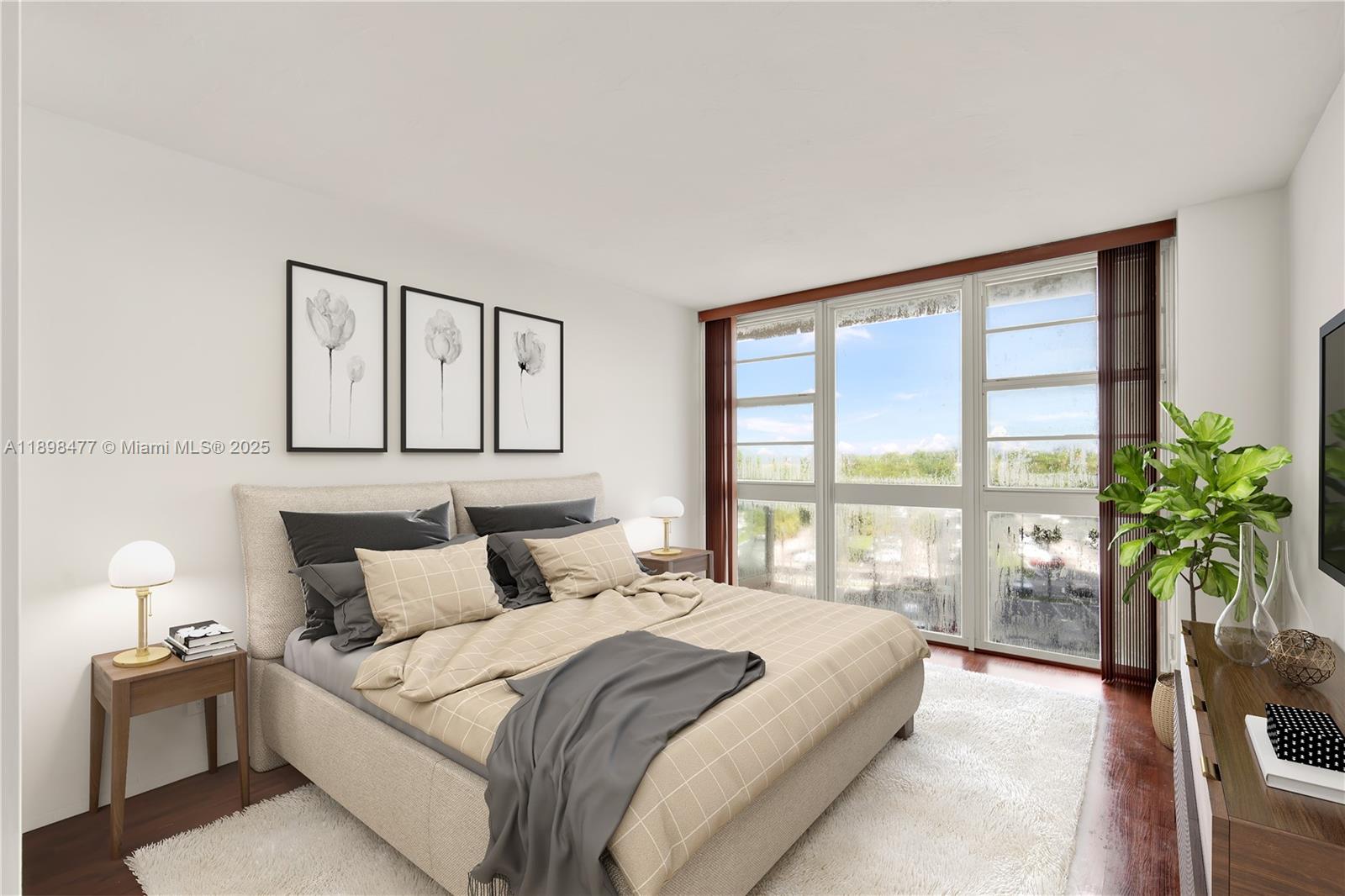 2451 Brickell Avenue, Unit 6N Miami, FL 33129 - Photo 22 of 43 a bedroom with a large bed and a potted plant