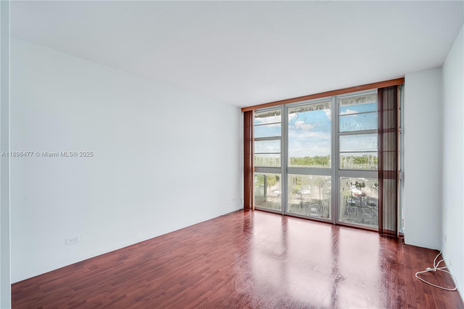 2451 Brickell Avenue, Unit 6N Miami, FL 33129 - Photo 24 of 43 wooden floor in an empty room with a window