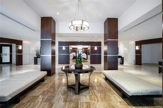 a kitchen with stainless steel appliances granite countertop a refrigerator a sink and a stove