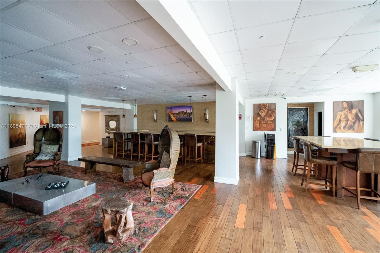 2451 Brickell Avenue, Unit 6N Miami, FL 33129 - Photo 42 of 43 a living room with furniture a wooden floor and next to dining room
