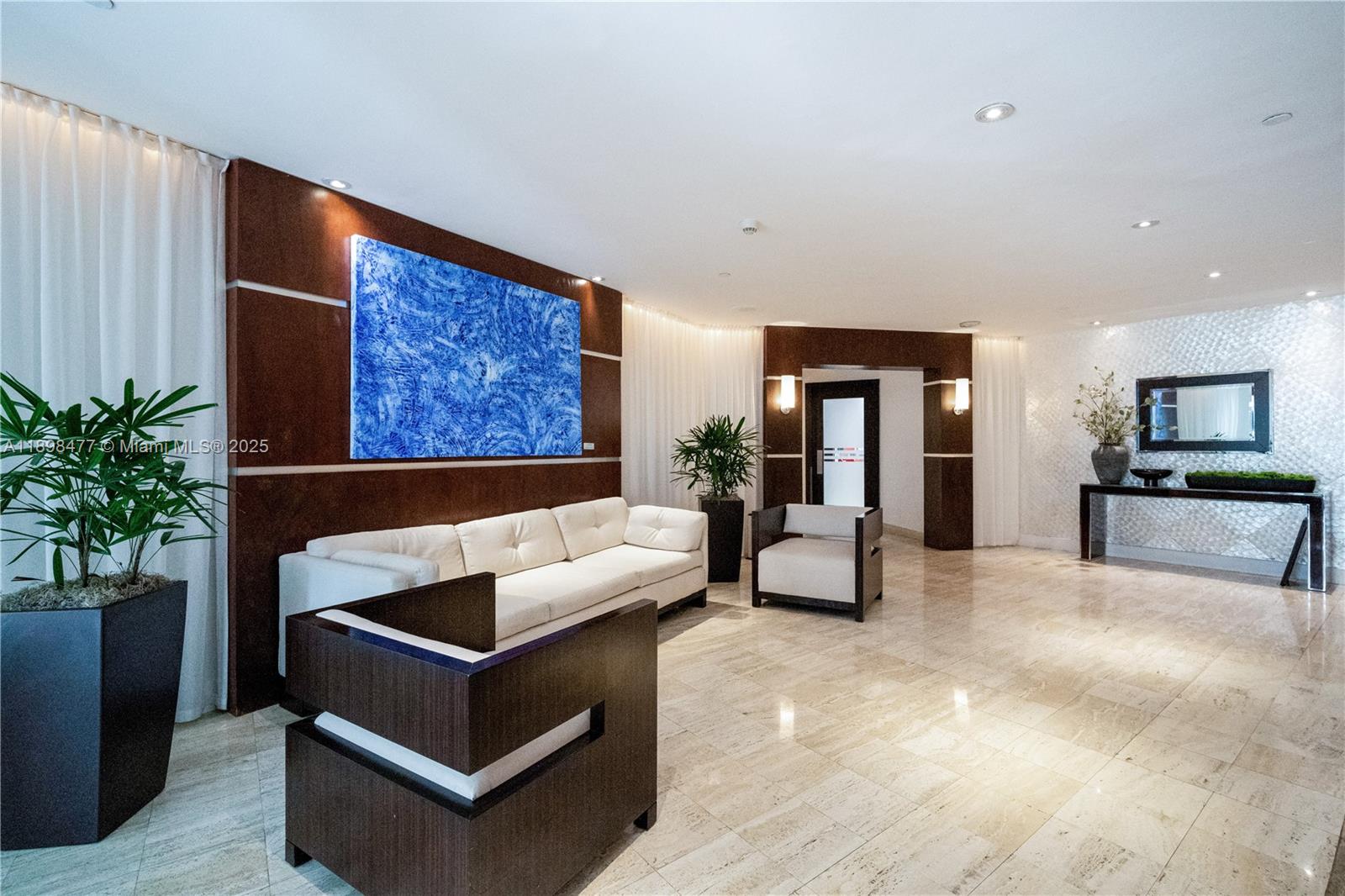 2451 Brickell Avenue, Unit 6N Miami, FL 33129 - Photo 5 of 43 a living room with furniture and wooden floor