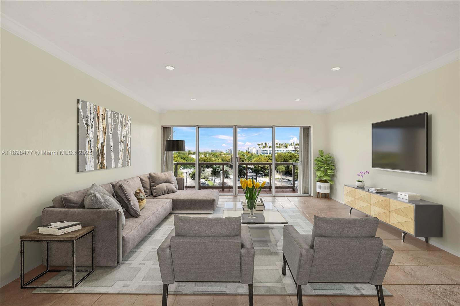 2451 Brickell Avenue, Unit 6N Miami, FL 33129 - Photo 10 of 43 a living room with furniture and a flat screen tv