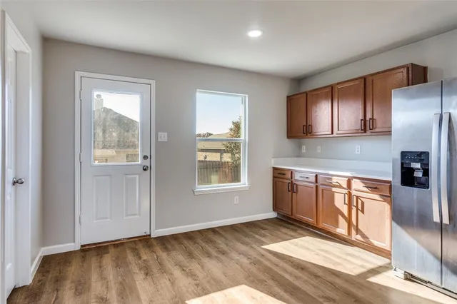 a kitchen with a sink stove and microwave