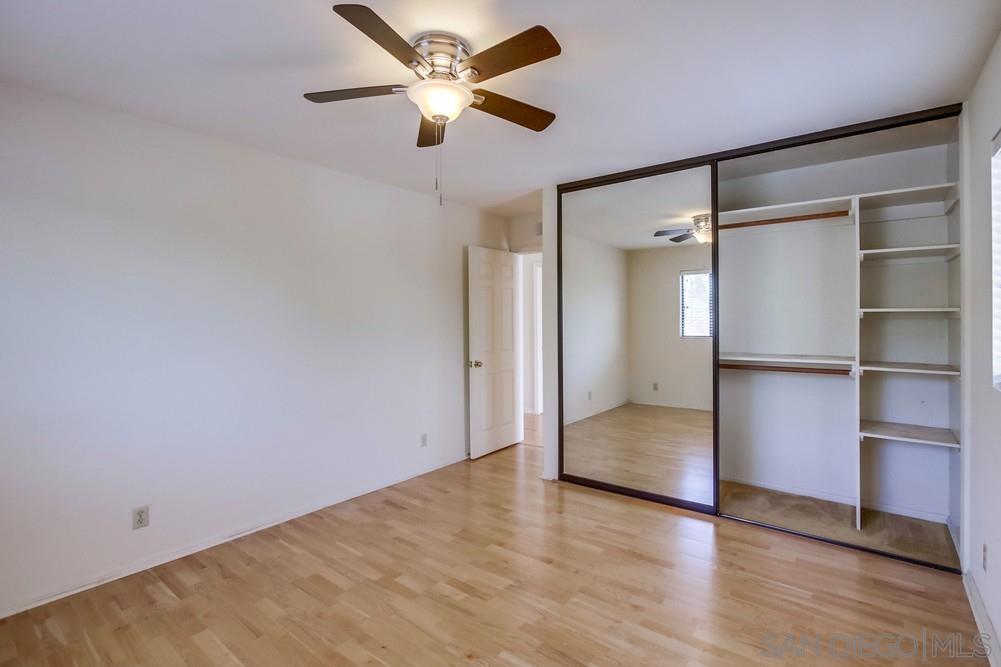 349 G Coronado, CA 92118 - Photo 15 of 18 an empty room with wooden floor and a ceiling fan