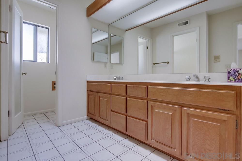 349 G Coronado, CA 92118 - Photo 16 of 18 a bathroom with a sink and a mirror