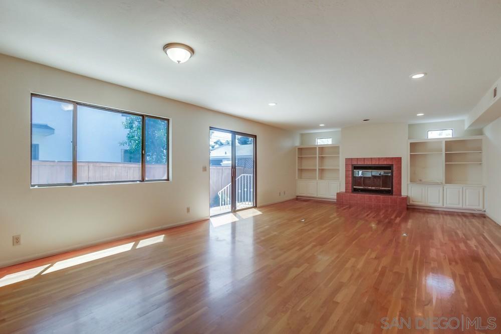 349 G Coronado, CA 92118 - Photo 10 of 18 a view of an empty room with wooden floor and a window