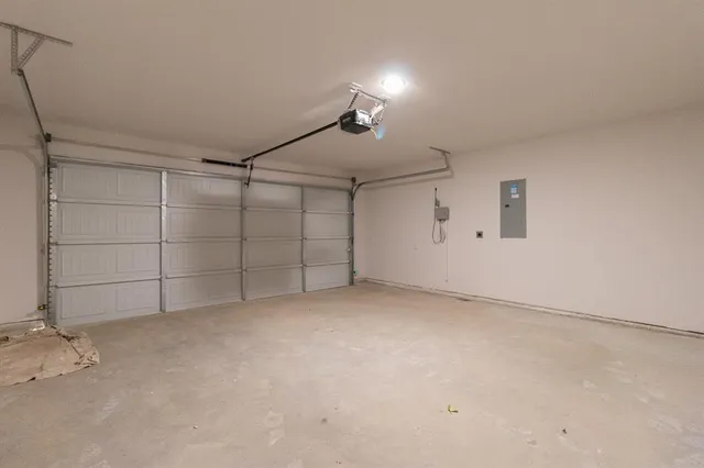 a view of kitchen with microwave and cabinets