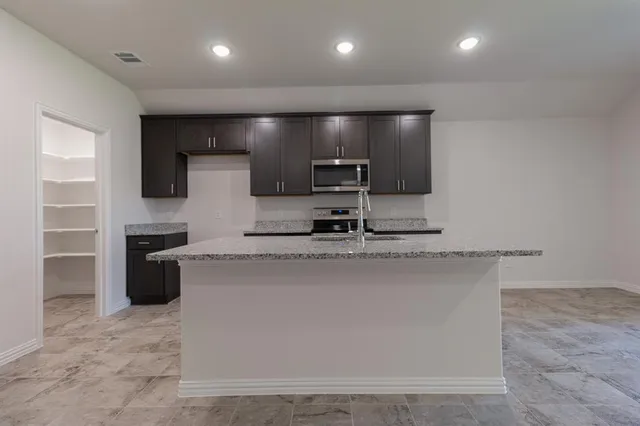 a view of a kitchen with a sink
