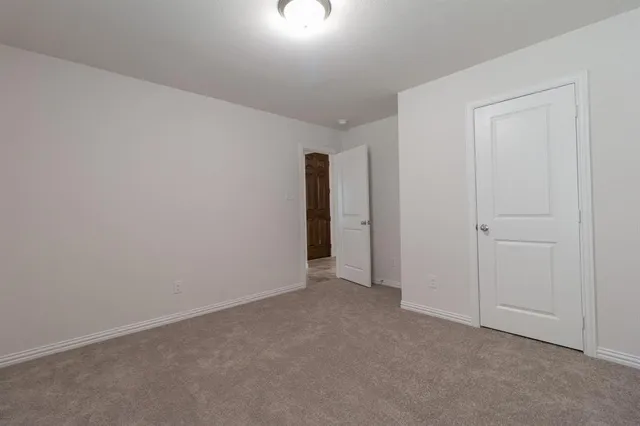 a view of an empty room and entryway
