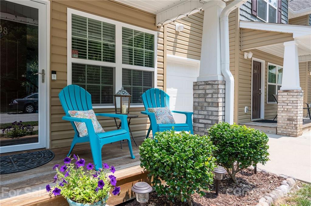 198 Alpine Ridge Drive Asheville, NC 28803 - Photo 2 of 24 a front view of a house with outdoor seating