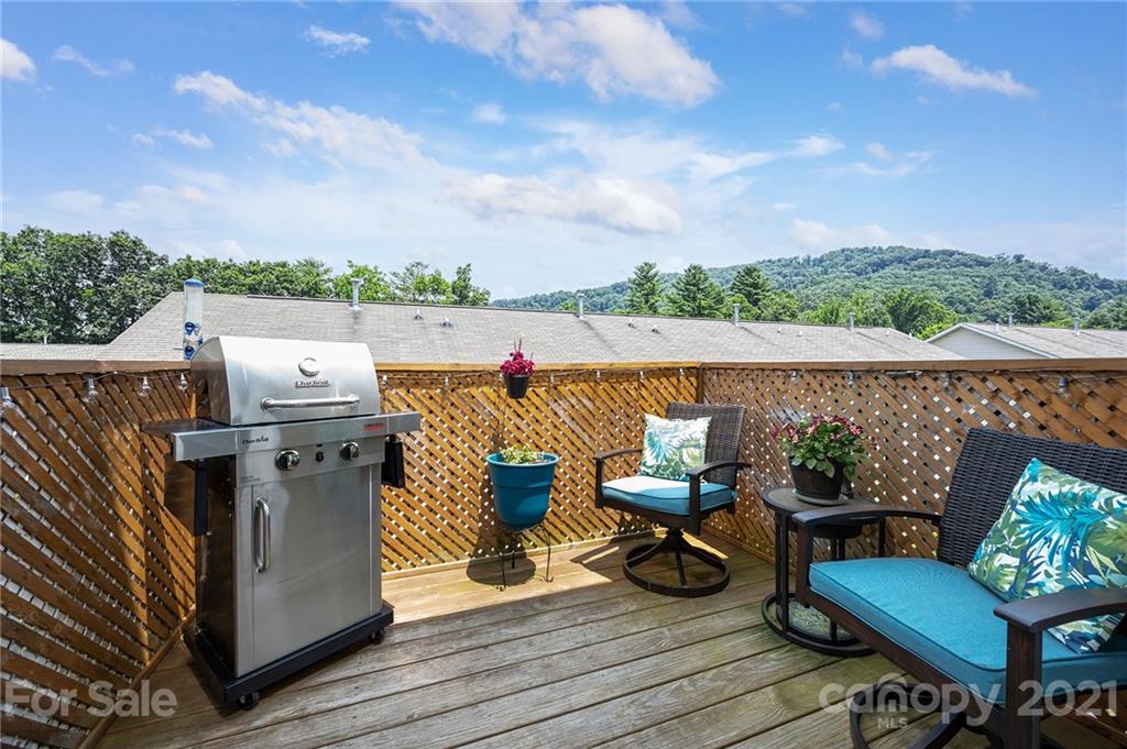198 Alpine Ridge Drive Asheville, NC 28803 - Photo 12 of 24 a view of roof deck with seating space and barbeque oven