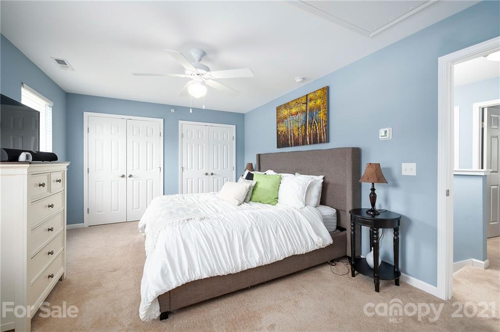 198 Alpine Ridge Drive Asheville, NC 28803 - Photo 13 of 24 a bedroom with a bed and a television