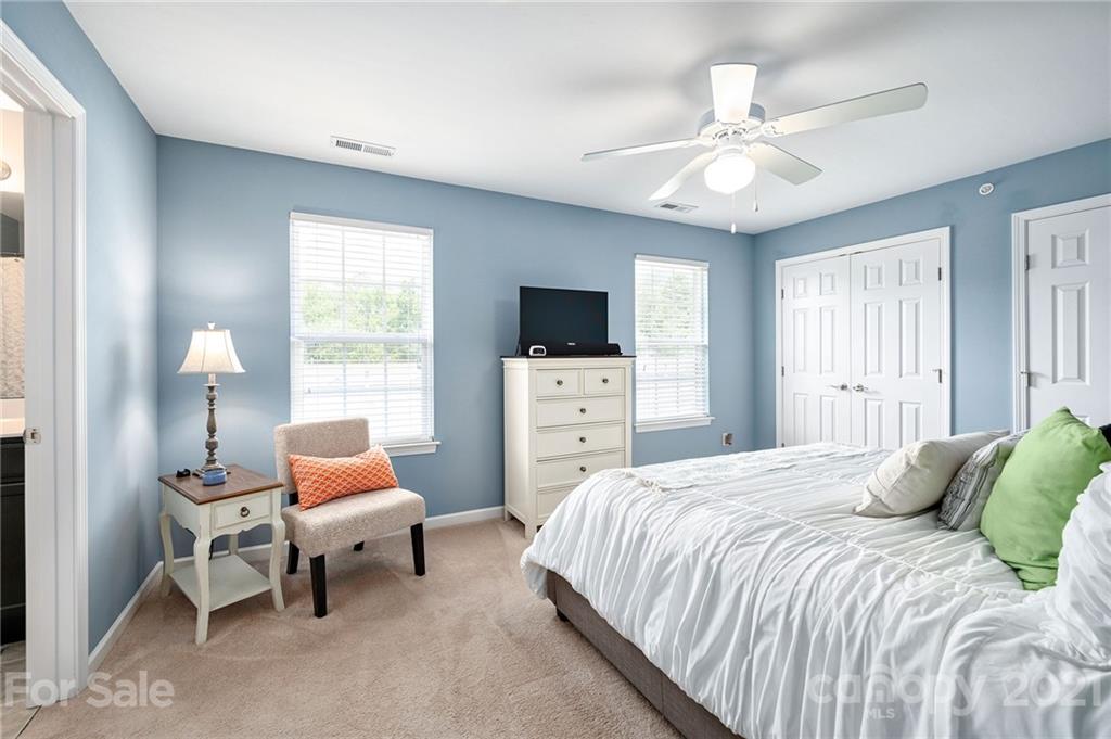 198 Alpine Ridge Drive Asheville, NC 28803 - Photo 14 of 24 a bedroom with a bed and a flat screen tv