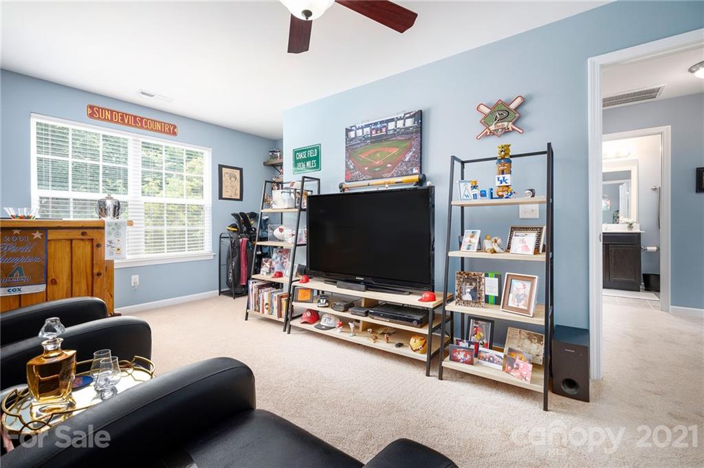 198 Alpine Ridge Drive Asheville, NC 28803 - Photo 18 of 24 a living room with furniture and a flat screen tv
