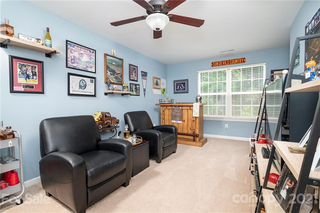 198 Alpine Ridge Drive Asheville, NC 28803 - Photo 19 of 24 a living room with furniture and a flat screen tv