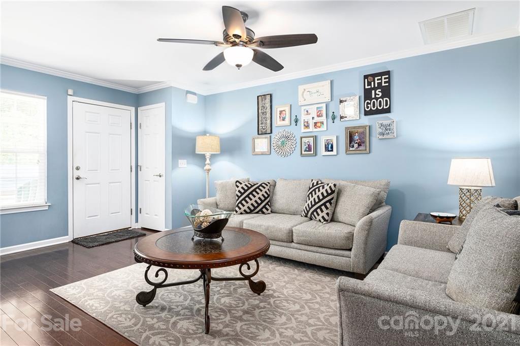 198 Alpine Ridge Drive Asheville, NC 28803 - Photo 5 of 24 a living room with furniture and a wooden floor