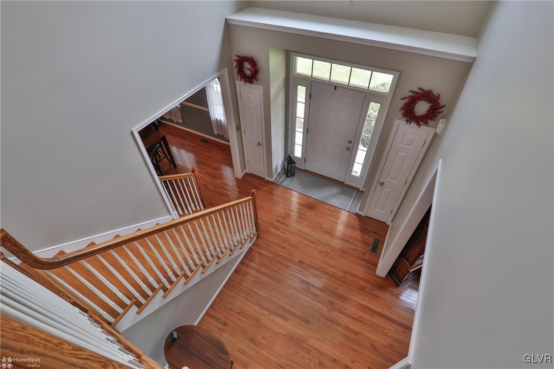 115 Kichline Road Hellertown, PA 18055 - Photo 14 of 45 a view of a hallway with wooden floor and staircase