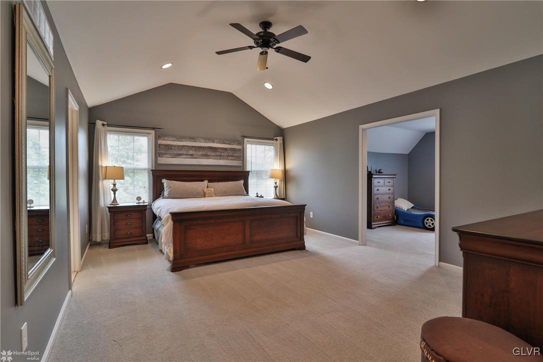 115 Kichline Road Hellertown, PA 18055 - Photo 18 of 45 a spacious bedroom with a bed and a ceiling fan