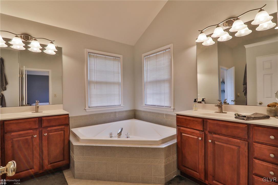 115 Kichline Road Hellertown, PA 18055 - Photo 21 of 45 a bathroom with a tub sink and mirror