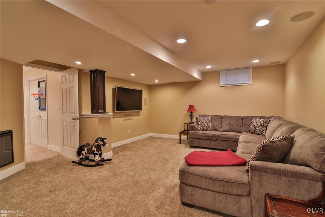 115 Kichline Road Hellertown, PA 18055 - Photo 31 of 45 a living room with furniture a flat screen tv and a couch