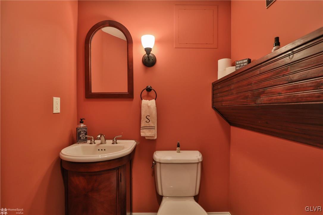 115 Kichline Road Hellertown, PA 18055 - Photo 35 of 45 a bathroom with a toilet sink and mirror