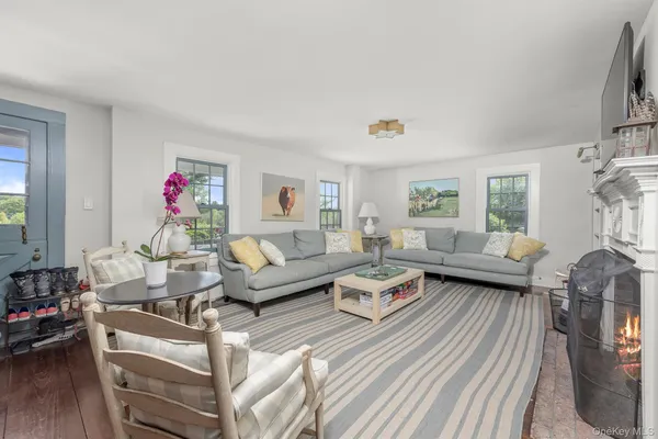 a living room with furniture or couch and a window