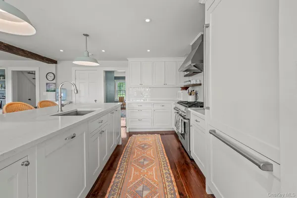 a kitchen with a sink and refrigerator
