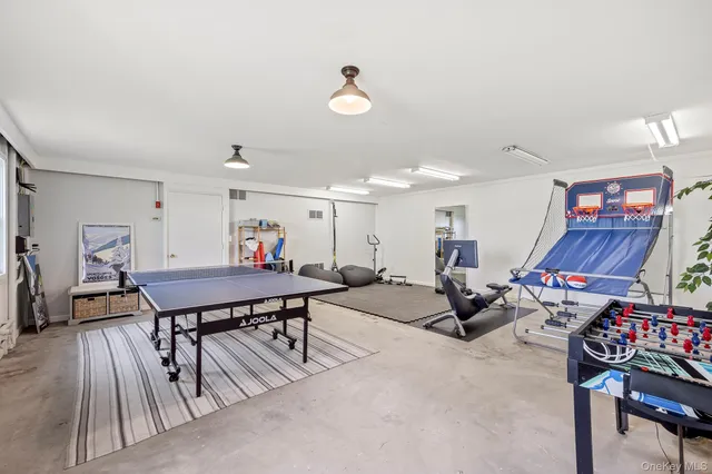 a living room with lots of furniture and a wooden floor