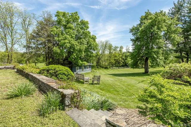 a garden view with a fountain