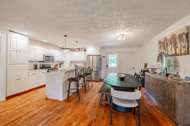 a bathroom with a sink a mirror and shower