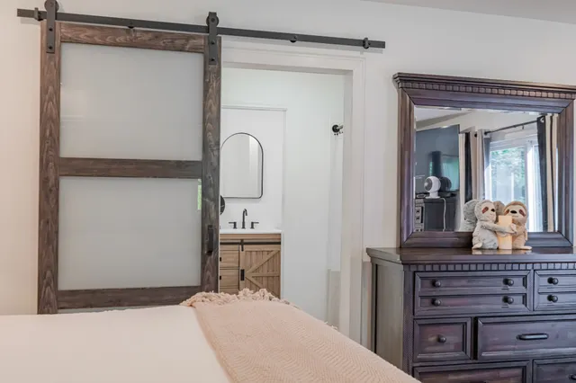 a bathroom with a double vanity sink mirror and