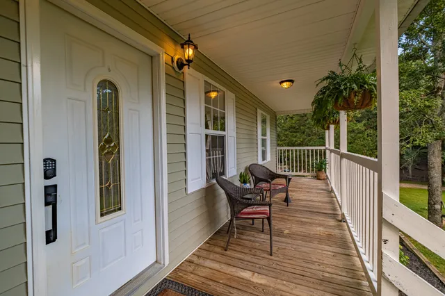 a view of balcony with furniture
