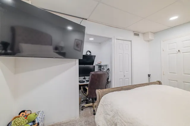 a kitchen with stainless steel appliances granite countertop a sink a stove and a refrigerator