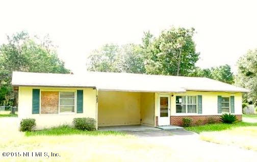a view of a house with garden and yard