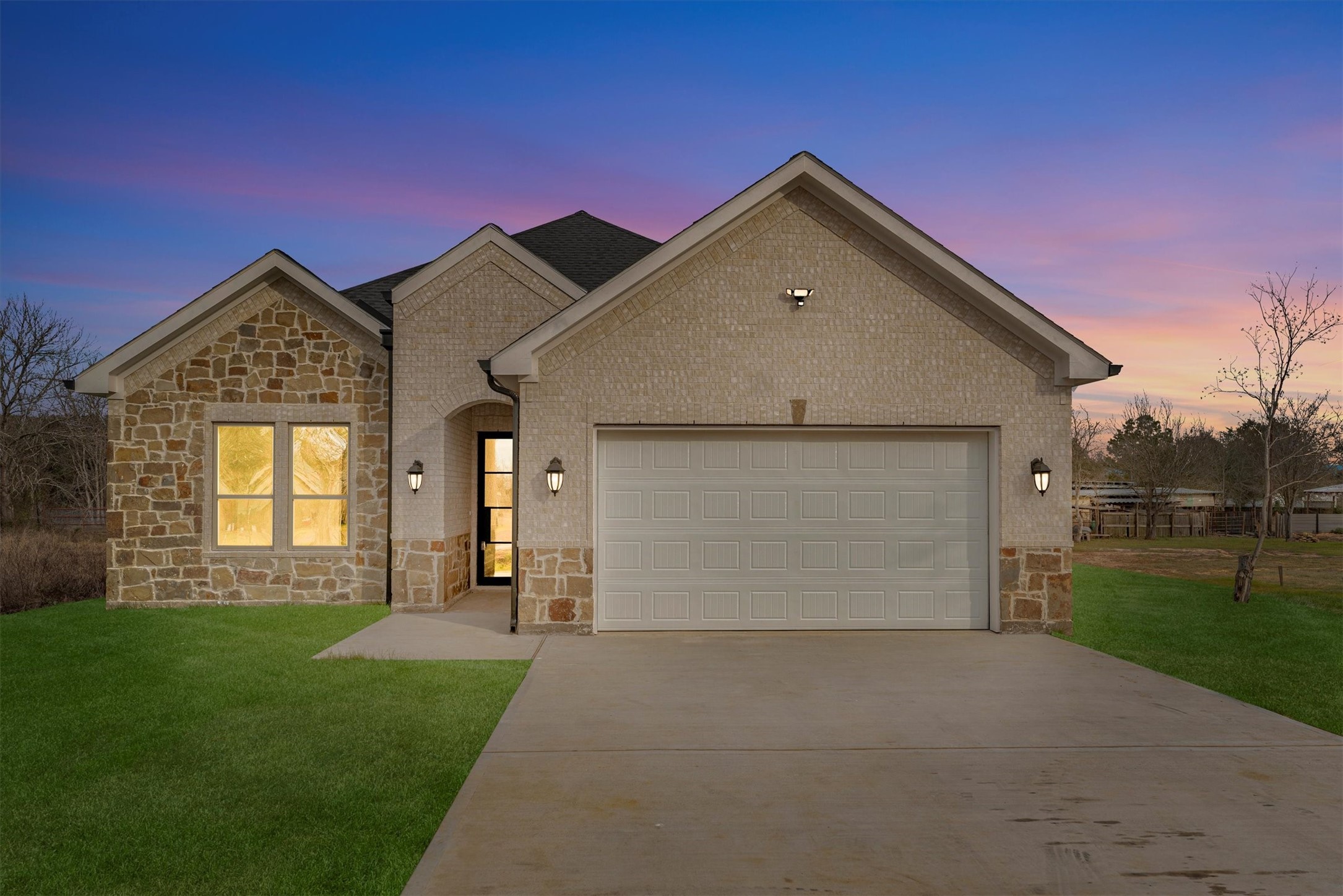 610 Sharon Street Prairie View, TX 77484 - Photo 2 of 42 a front view of a house with a yard and garage