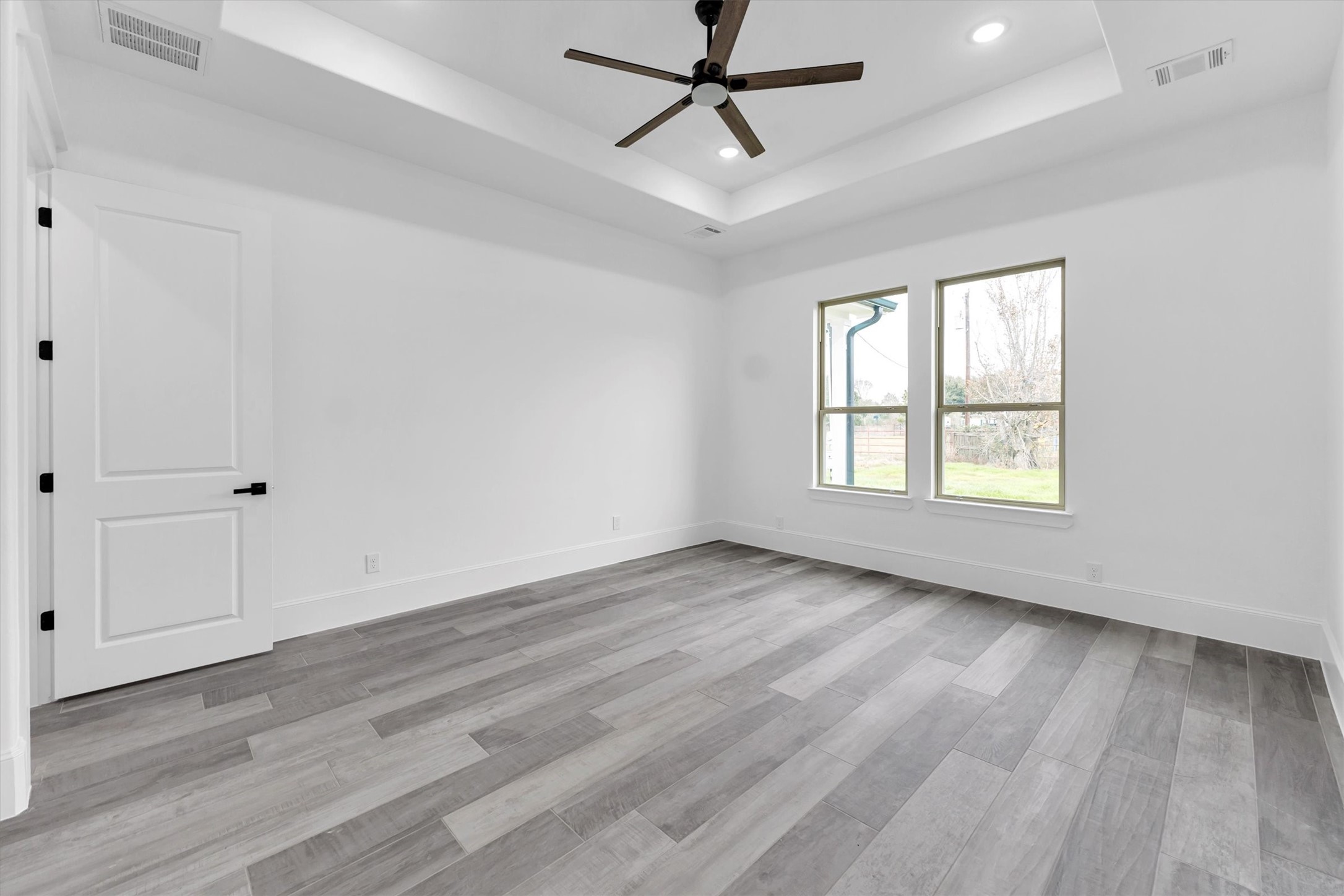 610 Sharon Street Prairie View, TX 77484 - Photo 27 of 42 wooden floor in an empty room with a window