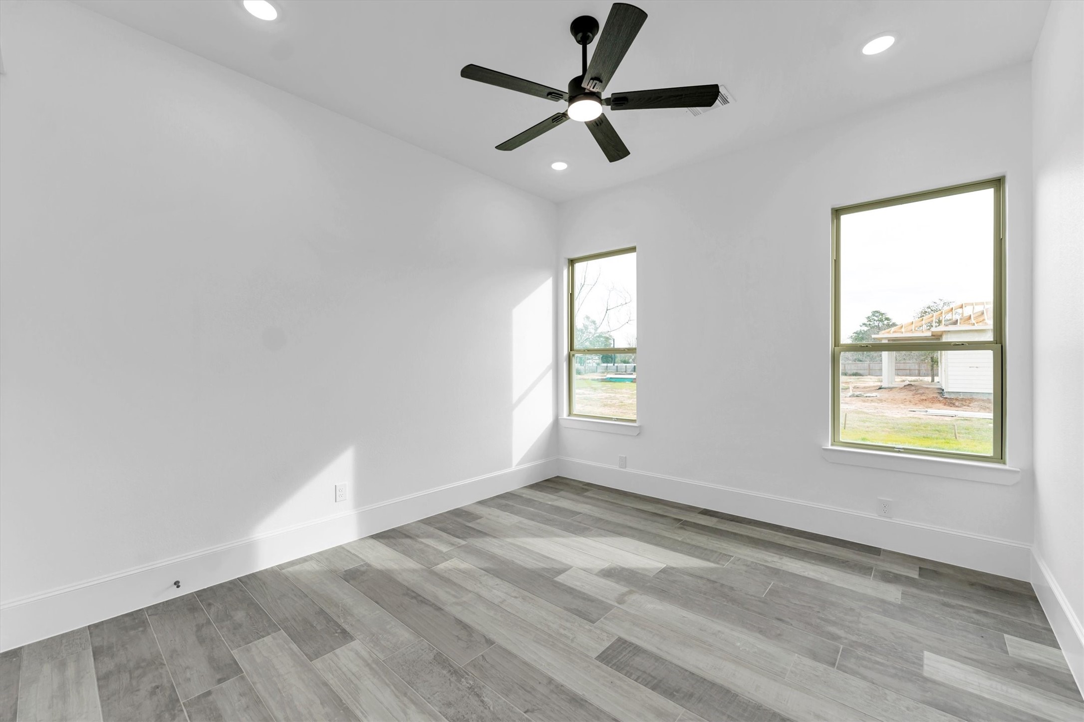 610 Sharon Street Prairie View, TX 77484 - Photo 36 of 42 wooden floor in an empty room with a window