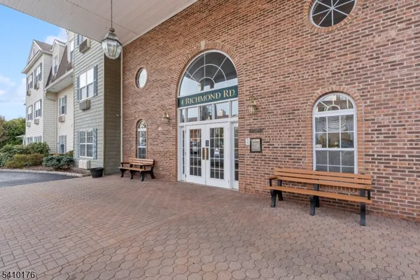 a front view of a house with outdoor space