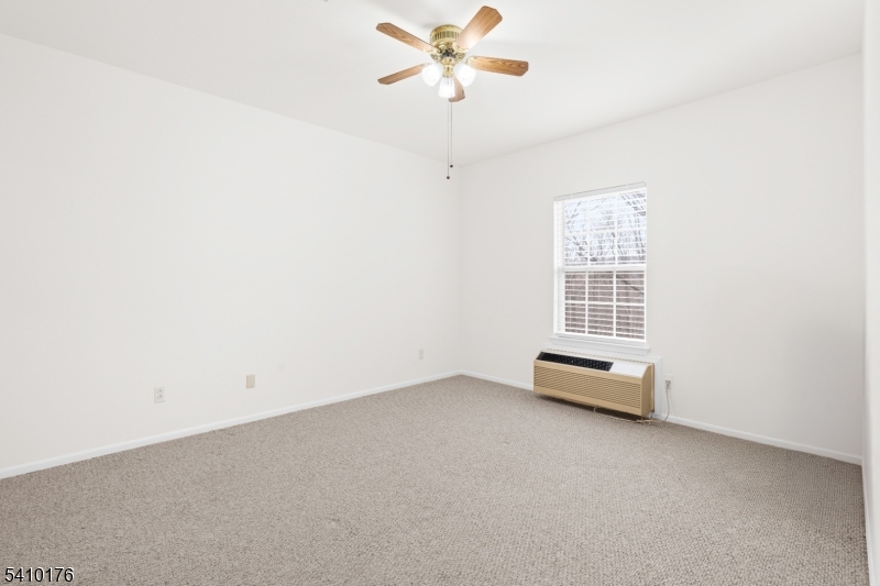4 Richmond Road West Milford, NJ 07480 - Photo 14 of 25 an empty room with windows and fan