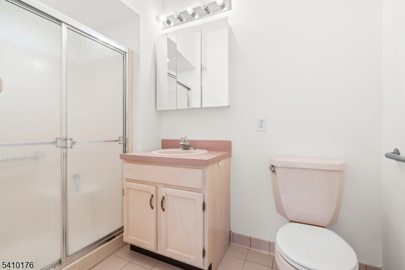 4 Richmond Road West Milford, NJ 07480 - Photo 16 of 25 a bathroom with a toilet sink and mirror