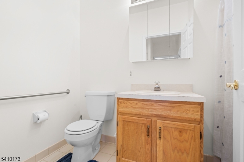 4 Richmond Road West Milford, NJ 07480 - Photo 17 of 25 a bathroom with a toilet a sink and mirror